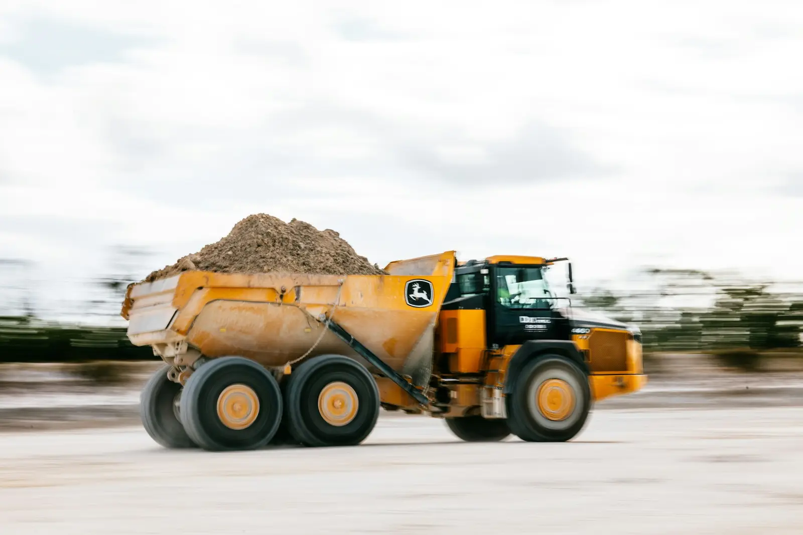 A loaded articulated dump truck on the move